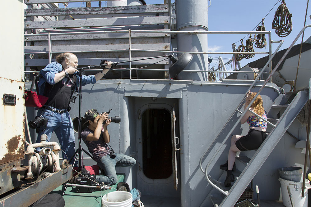 Kent teaches during a photo shoot at the SS Jeremiah Johnson photoshoot with model Ashley Tarr.